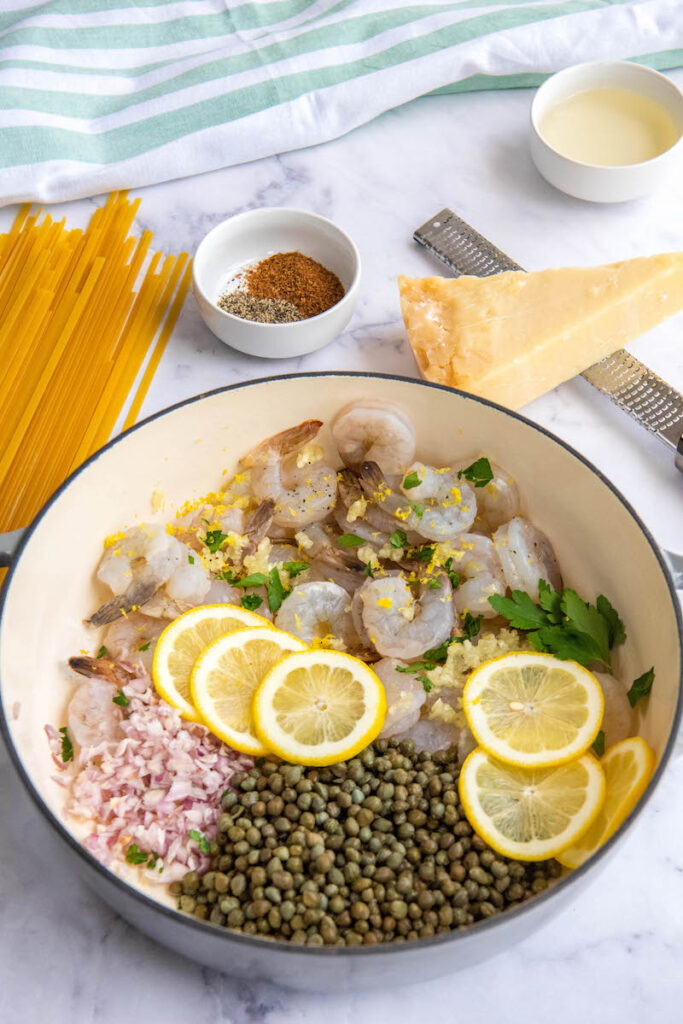 Ingredients for Shrimp Scampi in a large pan.