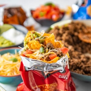 An open Dorito bag contains all the ingredients for walking tacos