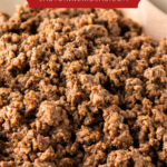 Up close image of ground taco meat in a skillet.