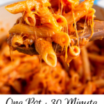 Easy one pot penne on a spoon with cheese on top with wording on bottom for pinterest.