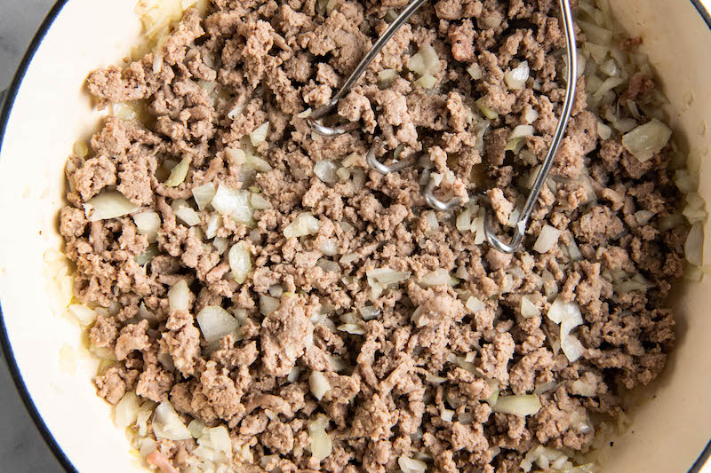 Browned meat and onion in a large skillet.