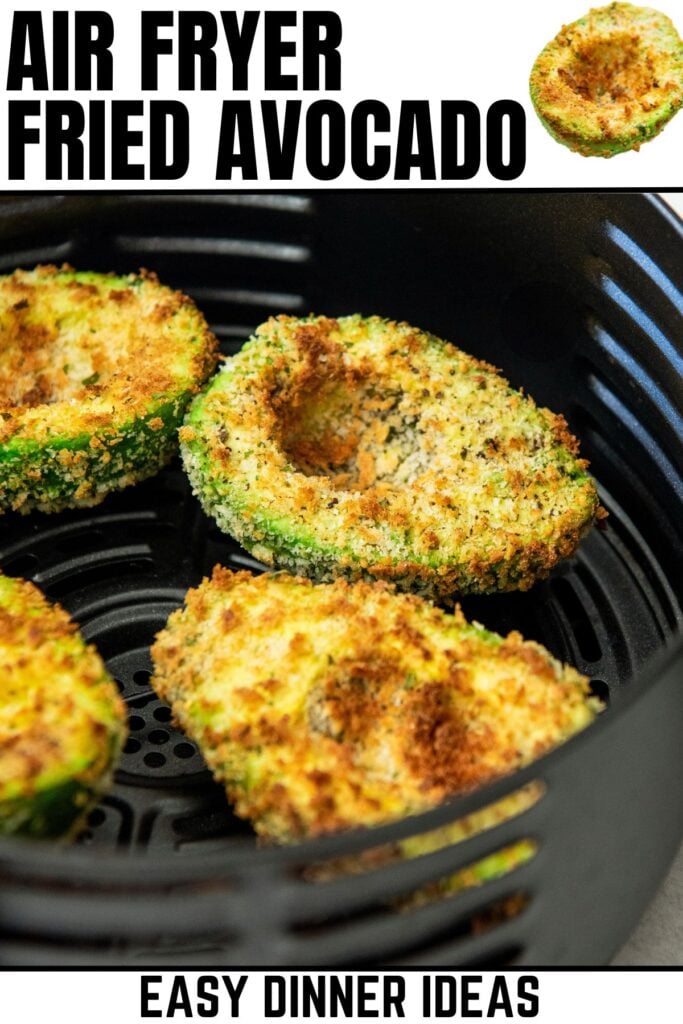 Easy air fryer fried avocado halves in the basket of an air fryer.