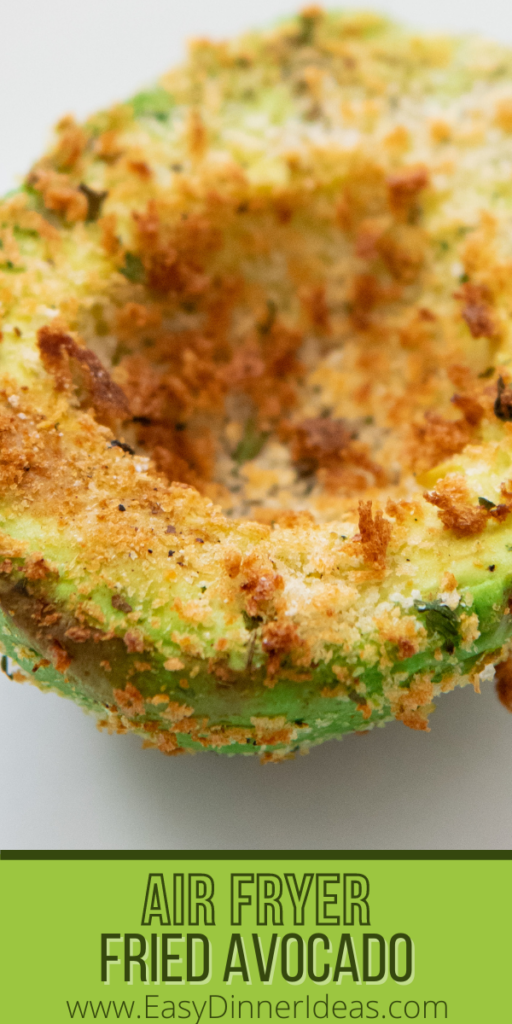 Up close image of A half on an air fried avocado on a white plate.