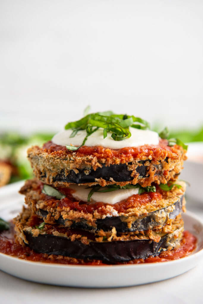 Stacked eggplant parmesan on a plate
