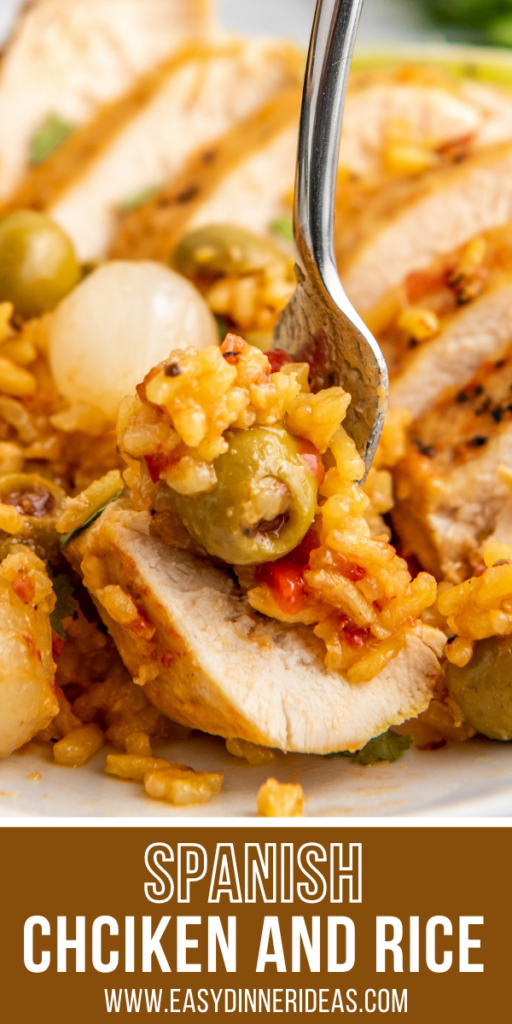 Pinterest image of a bite of spanish chicken and rice.