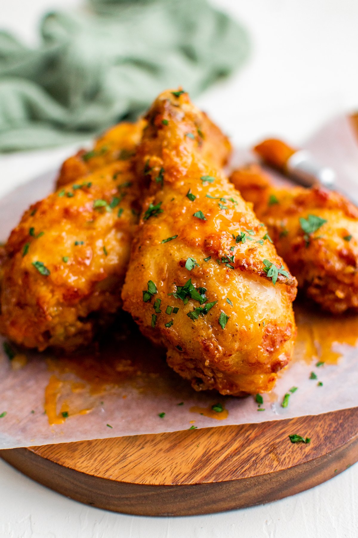 A serving of hot honey chicken is presented on a sheet of parchment paper.