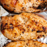 Three grilled chicken breast in foil