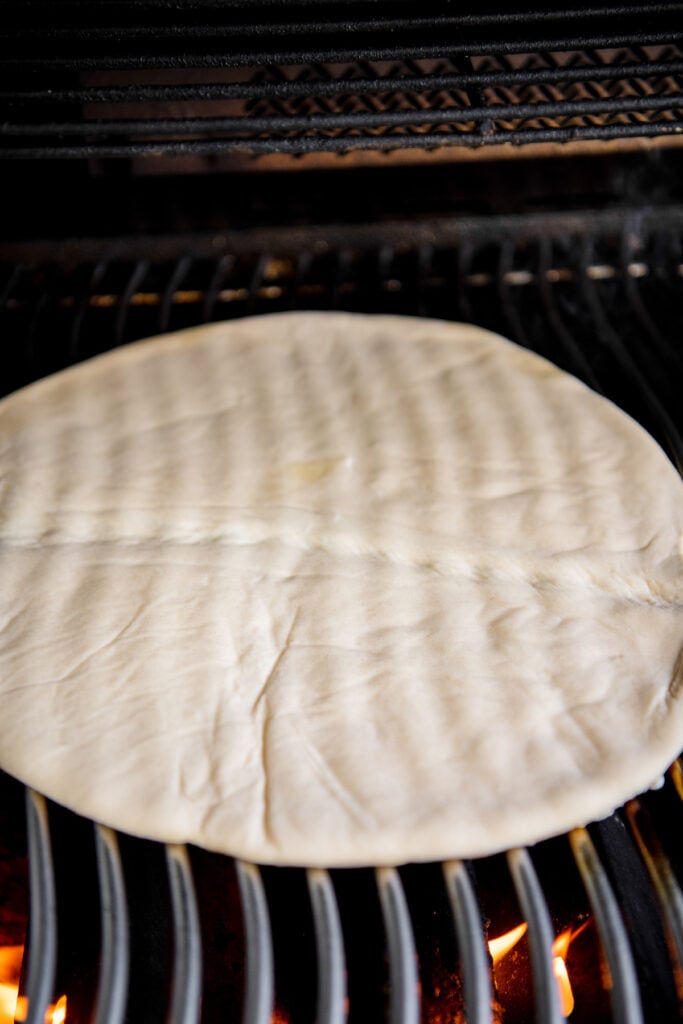 Pizza dough on a gas grill