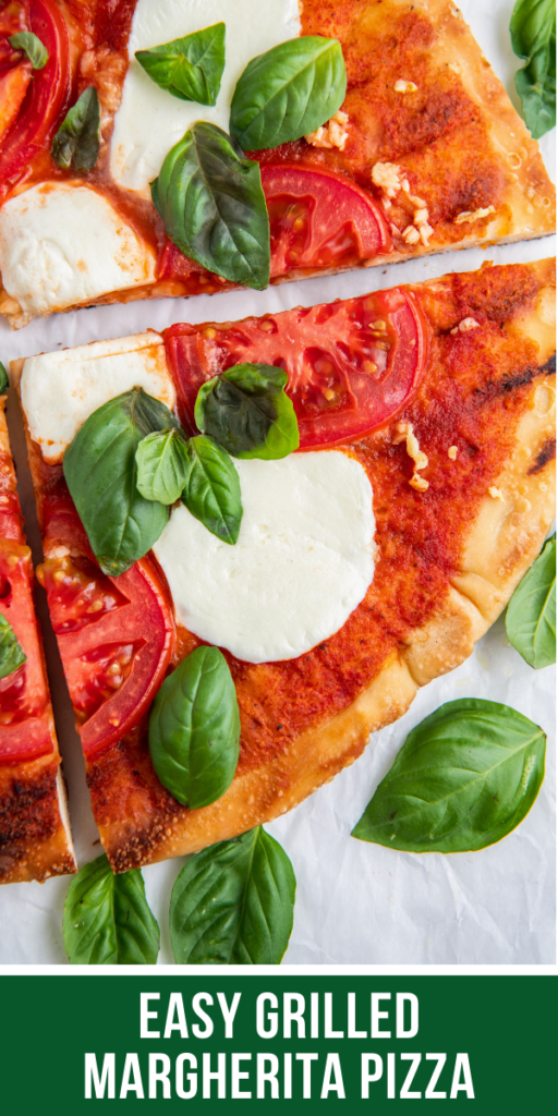 Up close image of grilled pizza with basil and mozzarella on top.