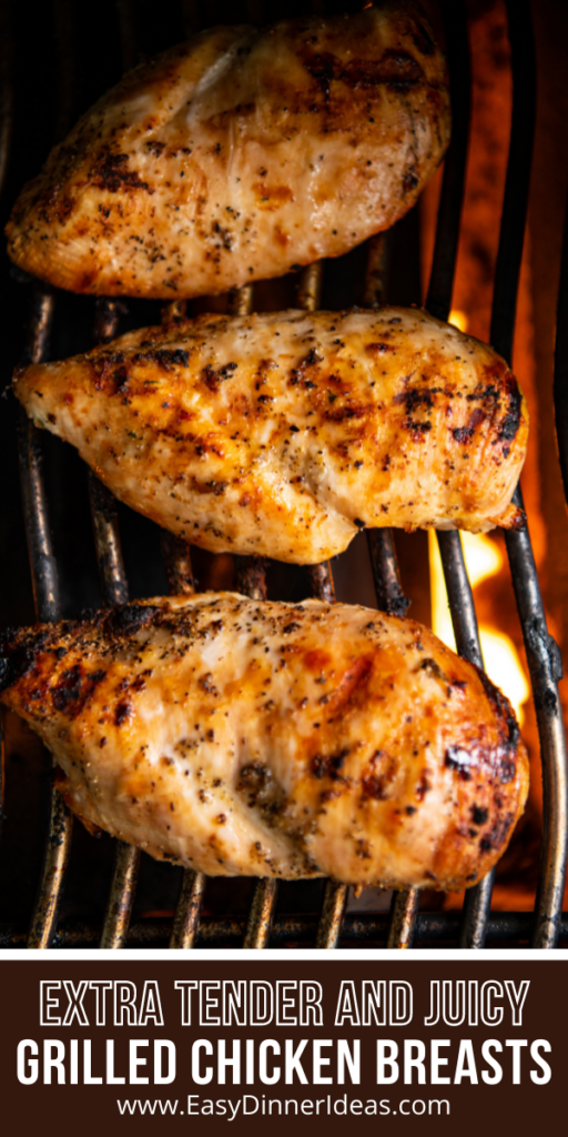3 Large chicken breast on a gas grill cooking.