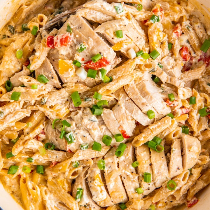 Chicken and pasta are in a pot, fully cooked and ready to eat.