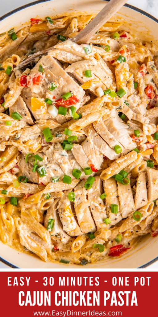 Up close image of Cajun Chicken Pasta with bell peppers and green onions sprinkled on top.