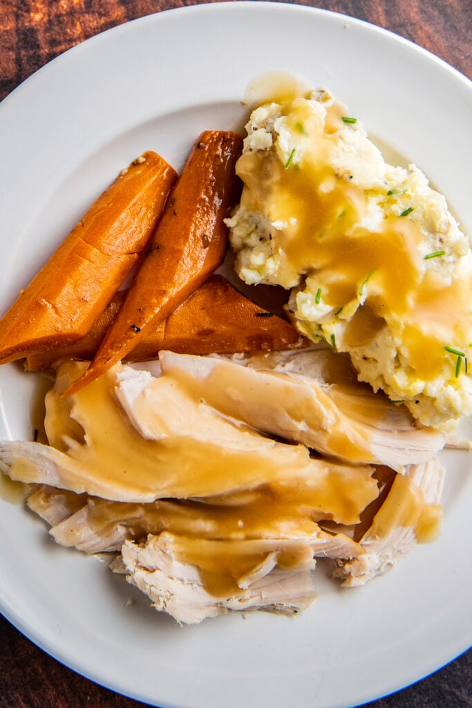 turkey, carrots, and mashed potatoes on a plate