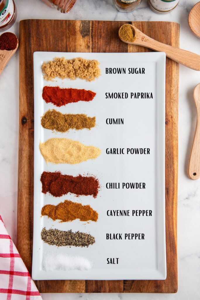 Recipe ingredients arranged on a white plate with text next to them saying what they are.