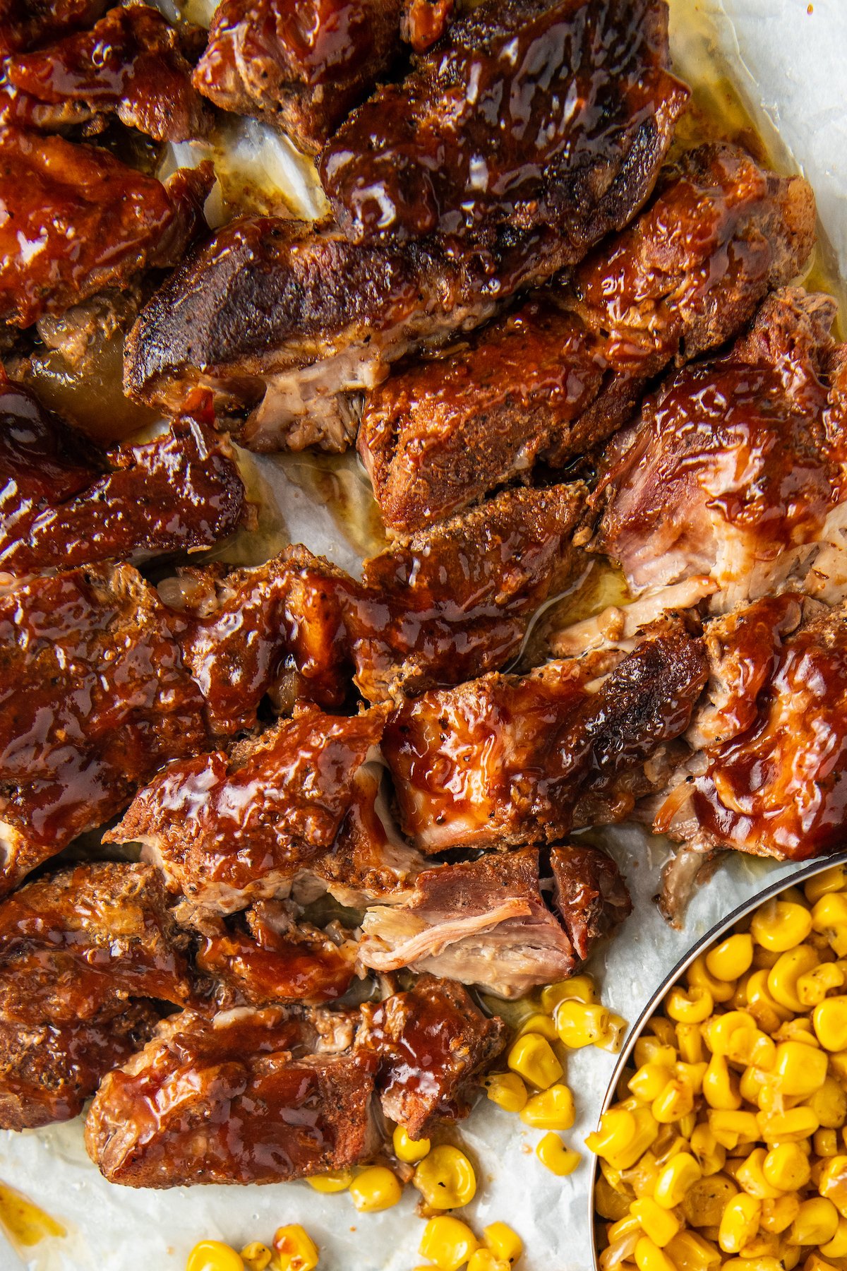 country style ribs with corn on parchment paper