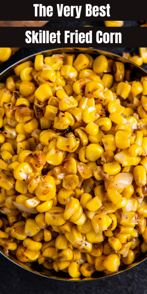 Overhead image of cooked corn with onions in a bowl.