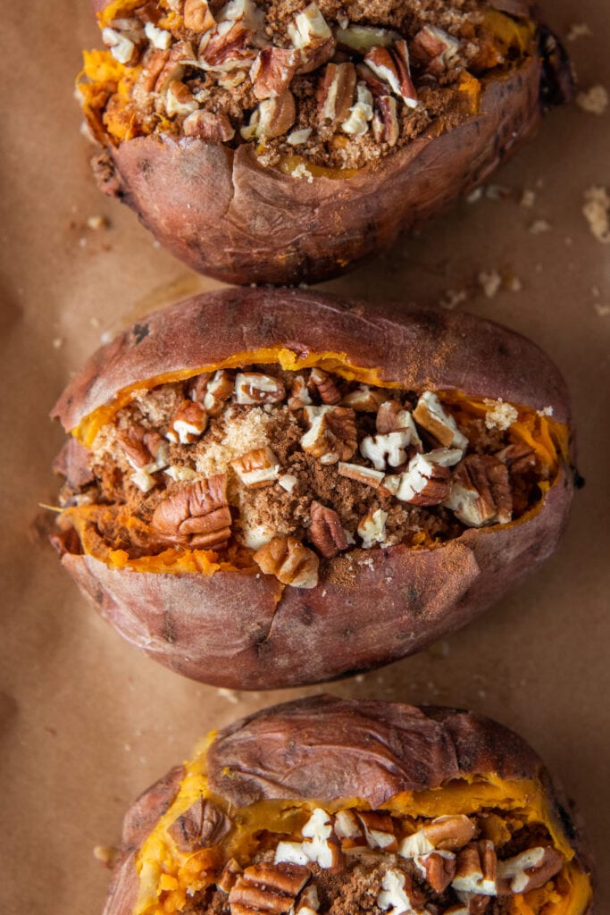Pecans, brown sugar and butter loaded inside cooked sweet potatoes.