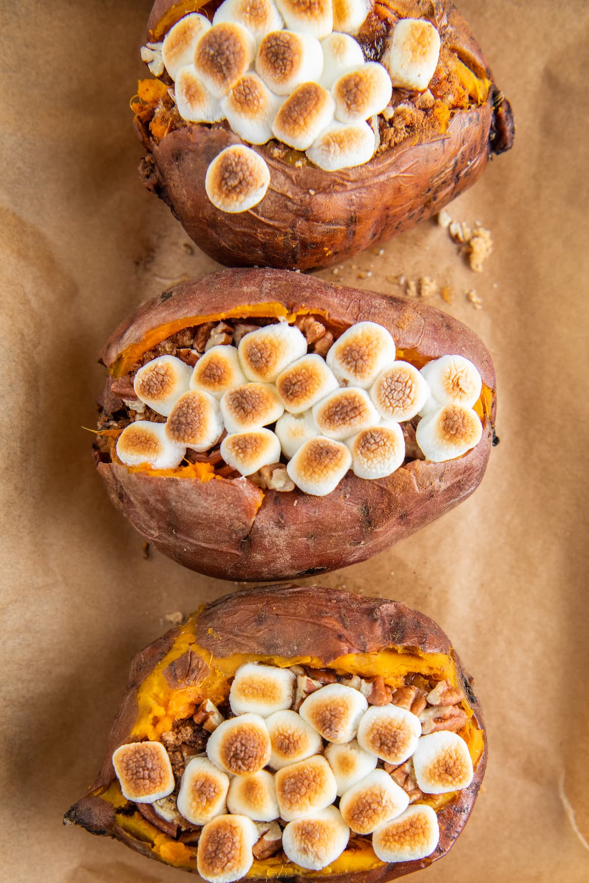 Twice baked sweet potatoes filled with butter, cinnamon, brown sugar, pecans and toasted marshmallows.