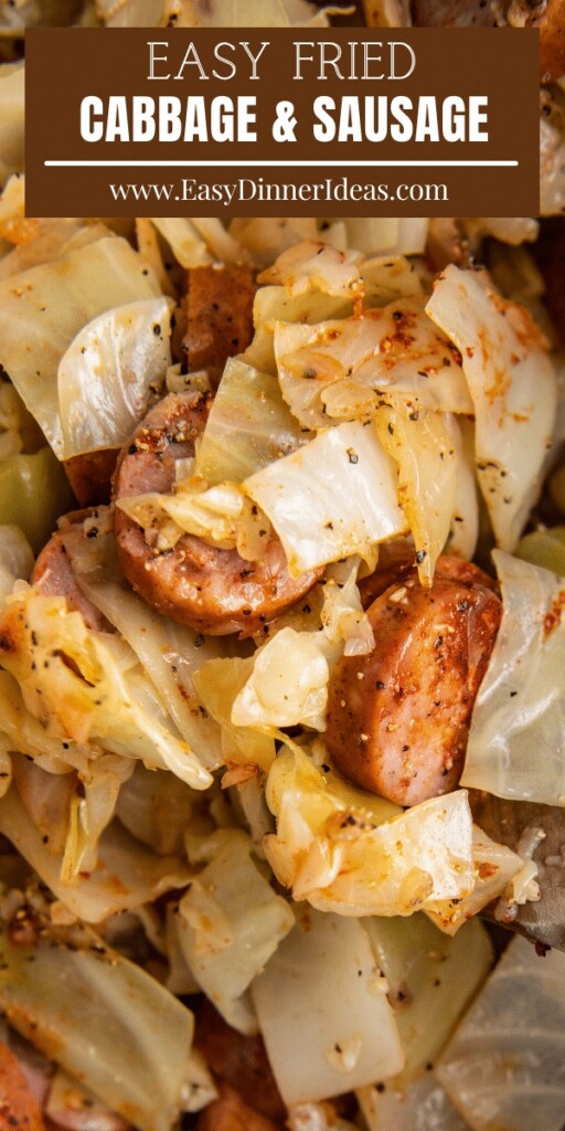Up close image of fried cabbage and sausage in a skillet.
