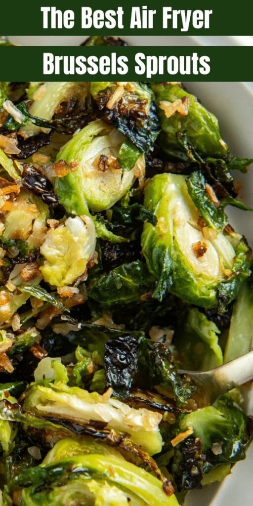 Air fried Brussels sprouts in a white bowl with a fork scooping some up.