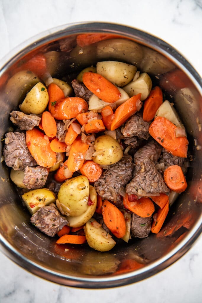 Potatoes, carrots, onions and stew meat in an instant pot.