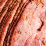Sliced spiral ham with homemade ham glaze.