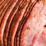 Sliced ham with ham glaze baked on.
