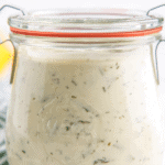 Homemade tartar sauce in a glass jar.
