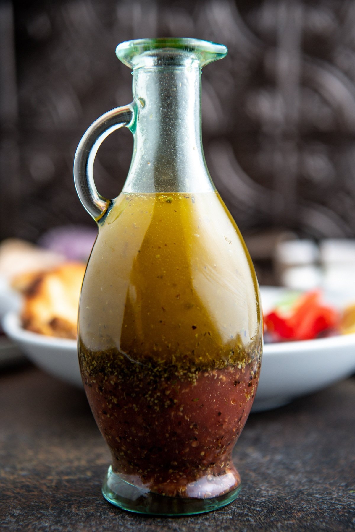 Greek salad dressing layered in a bottle.