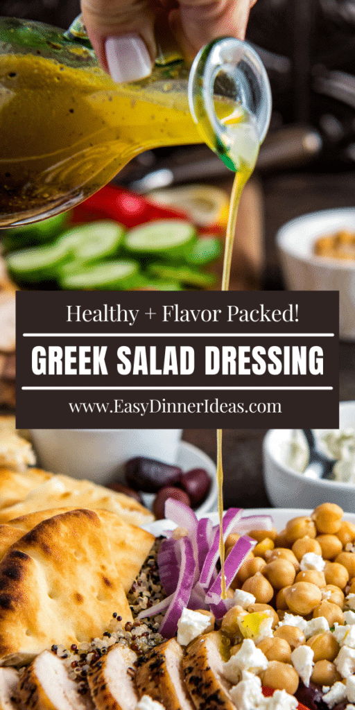 Salad dressing being poured out of a glass bottle into a greek salad.