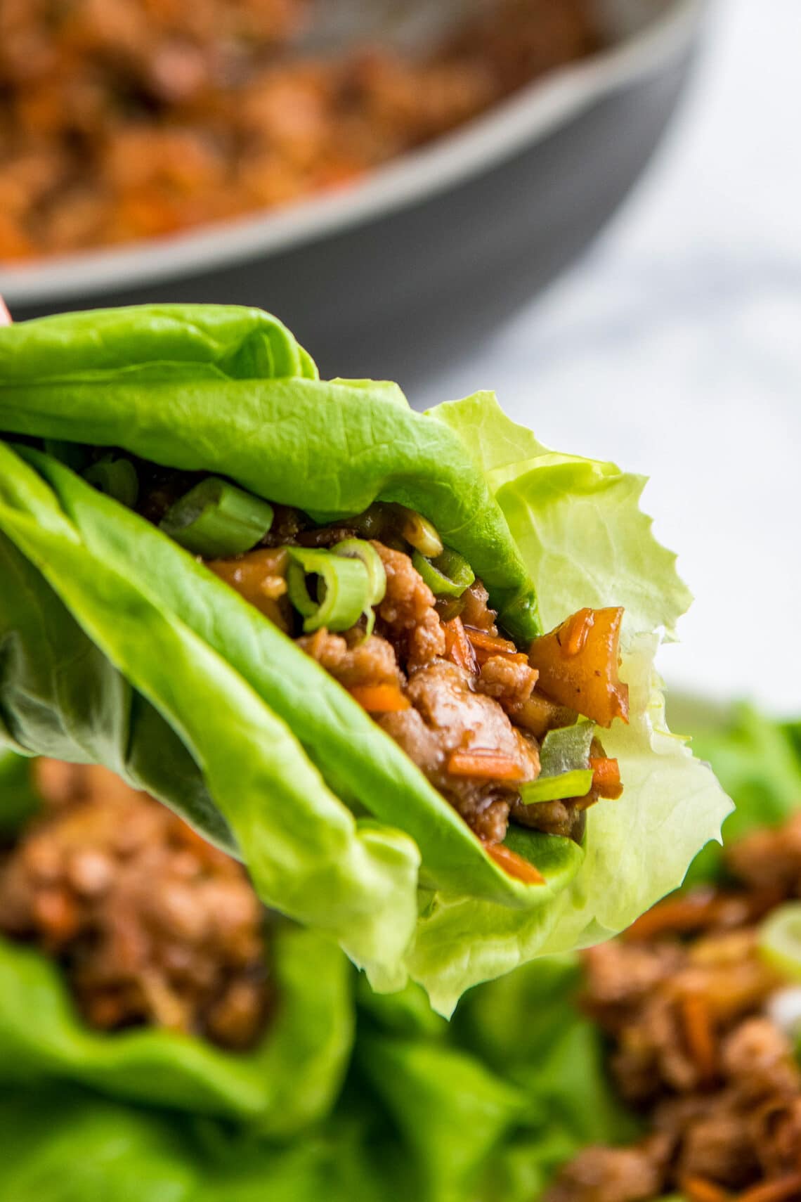A lettuce wrap with ground chicken.