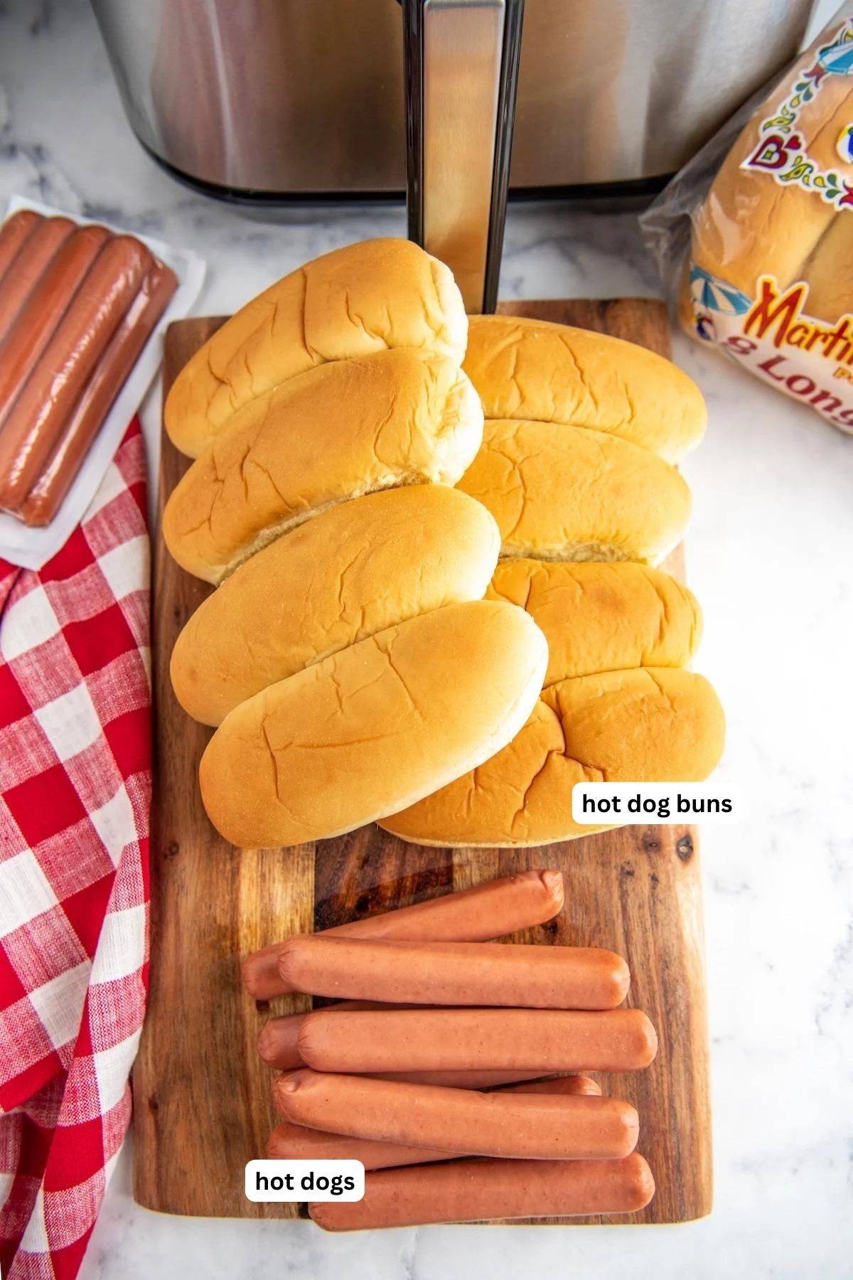 The ingredients for air fryer hot dogs are in order from top to bottom: hot dog buns and hot dogs. 