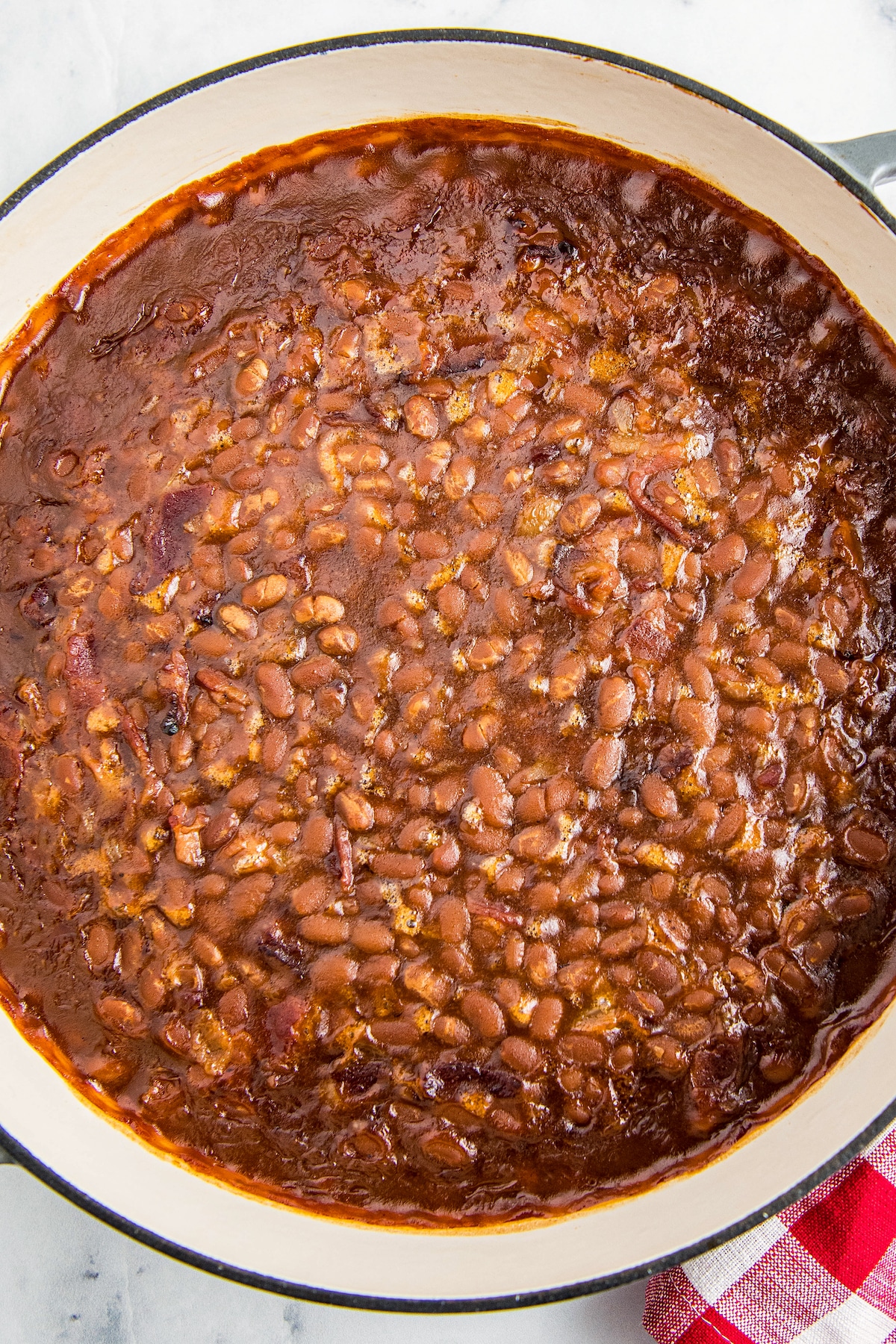 Baked beans in a cast iron skillet.