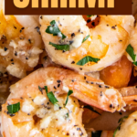 Garlic butter shrimp with parsley on top.