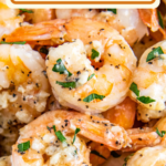 Garlic butter shrimp stacked on top of each other.