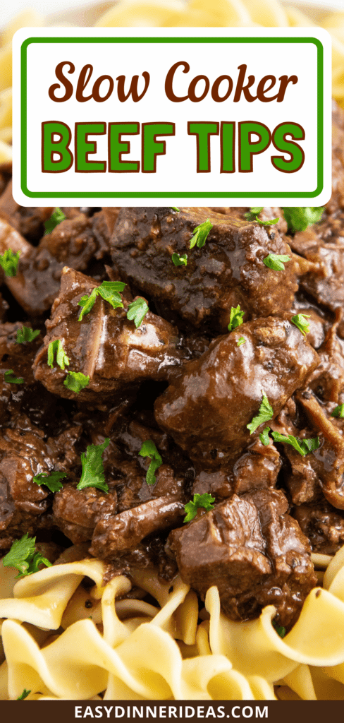 Up close image of beef tips on top of egg noodles.