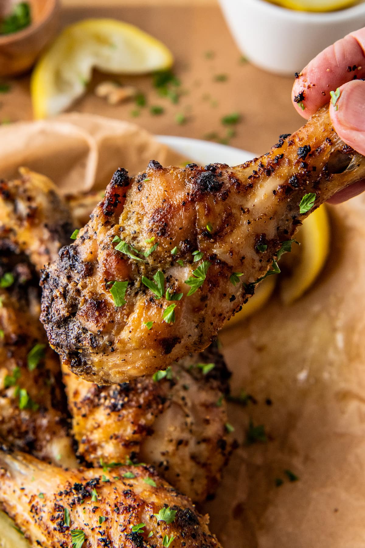 close up of a cooked chicken drumstick that is seasoned and air fried