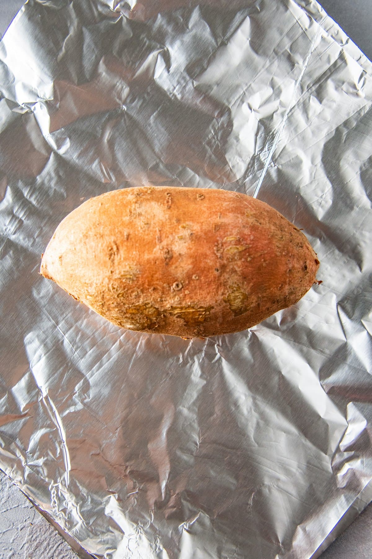 one sweet potato on foil