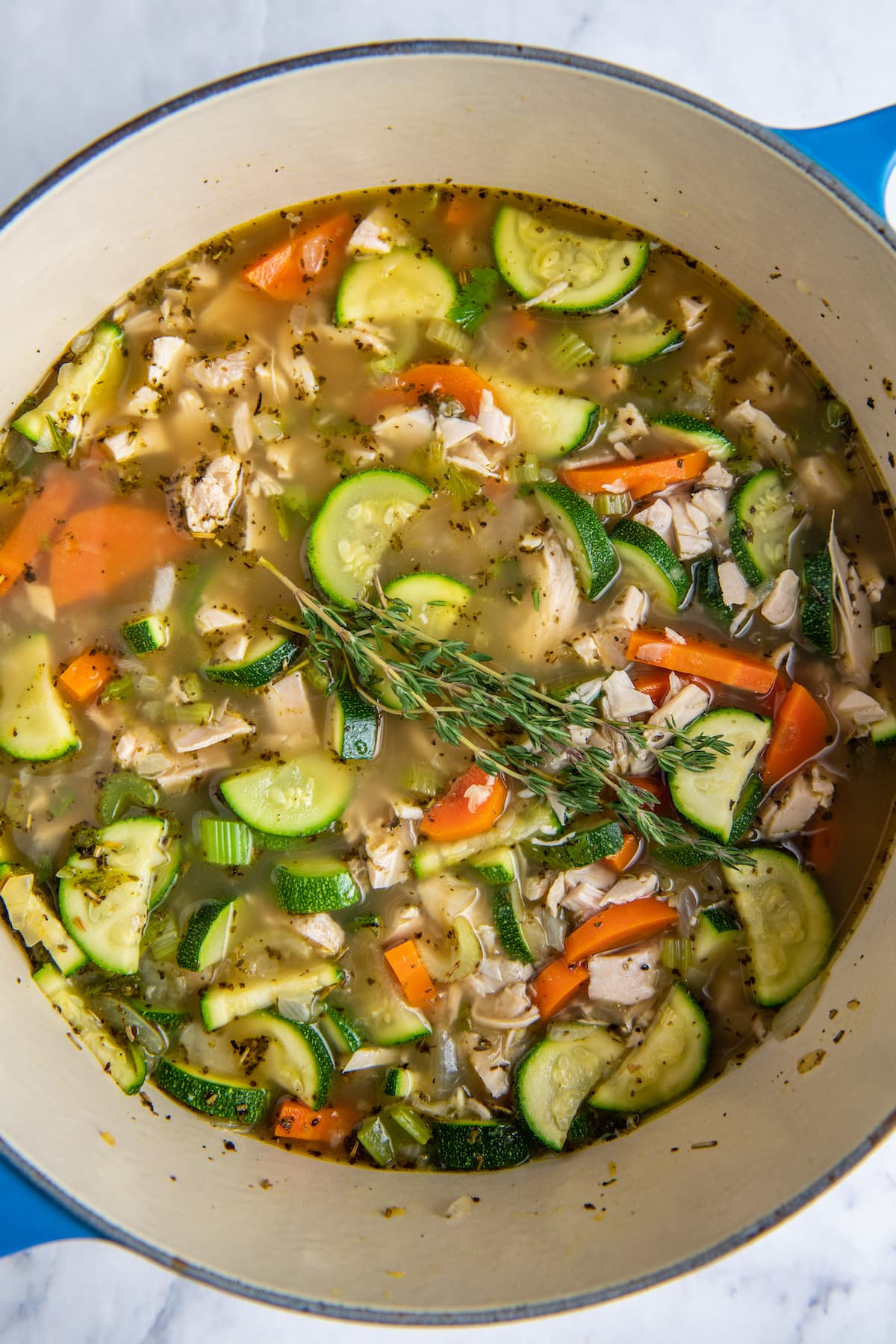 a large pot with chicken and rice soup