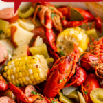 A pot full of crawfish boil with vegetables.