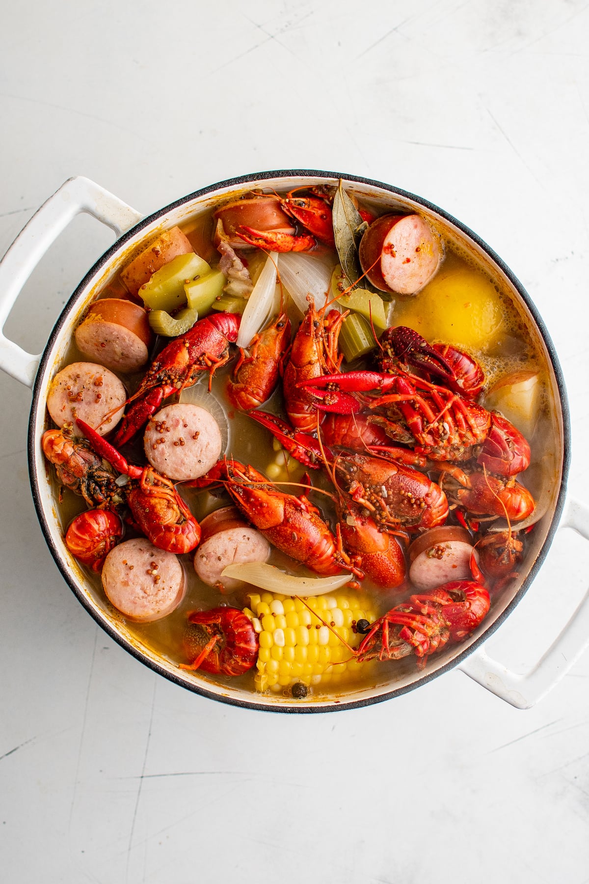 Crawfish, corn, sausage and more in a pot.