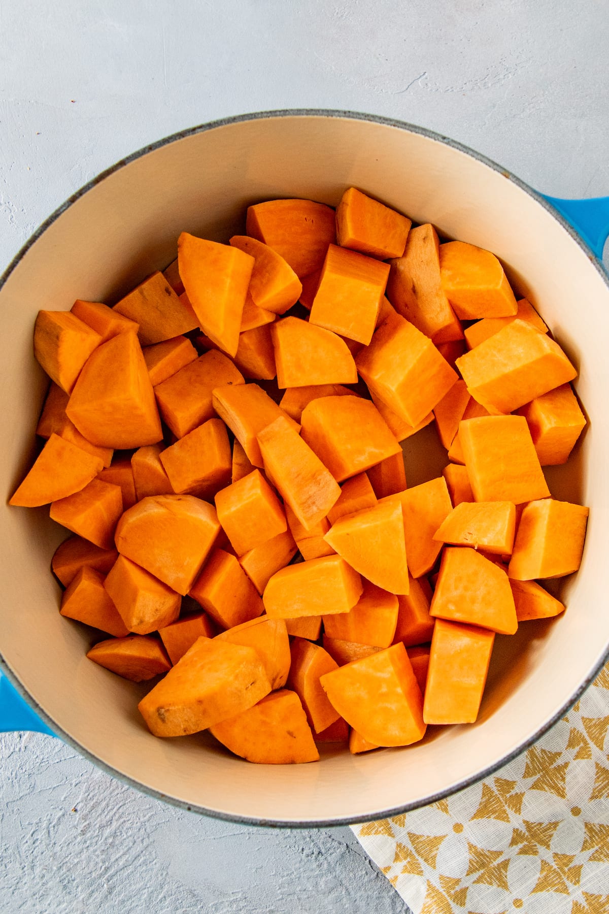 a pot with cubed sweet potatoe