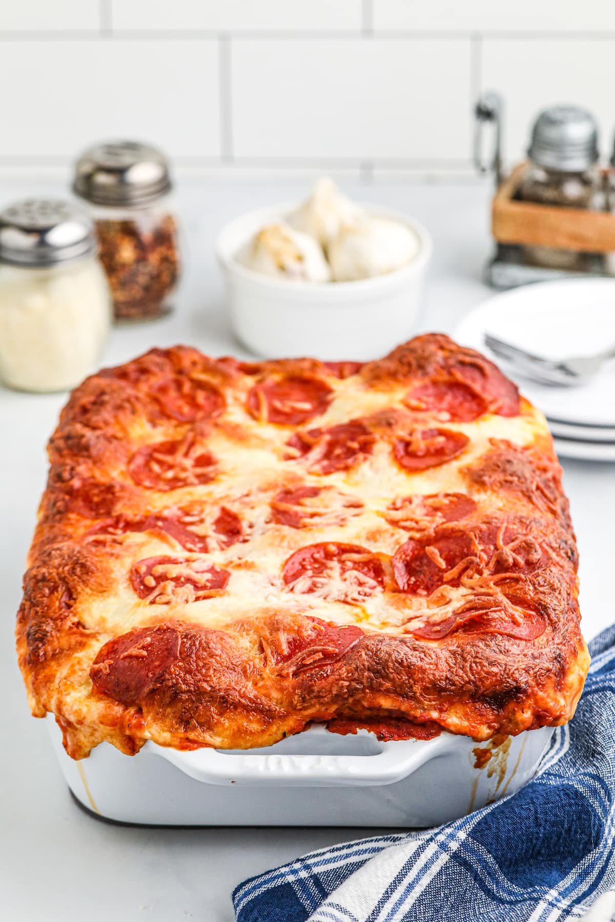 a pizza that's been baked in a large baking dish