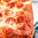 close up of pizza being baked in a casserole dish
