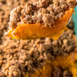 a slice of sweet potato casserole with crumbled topping