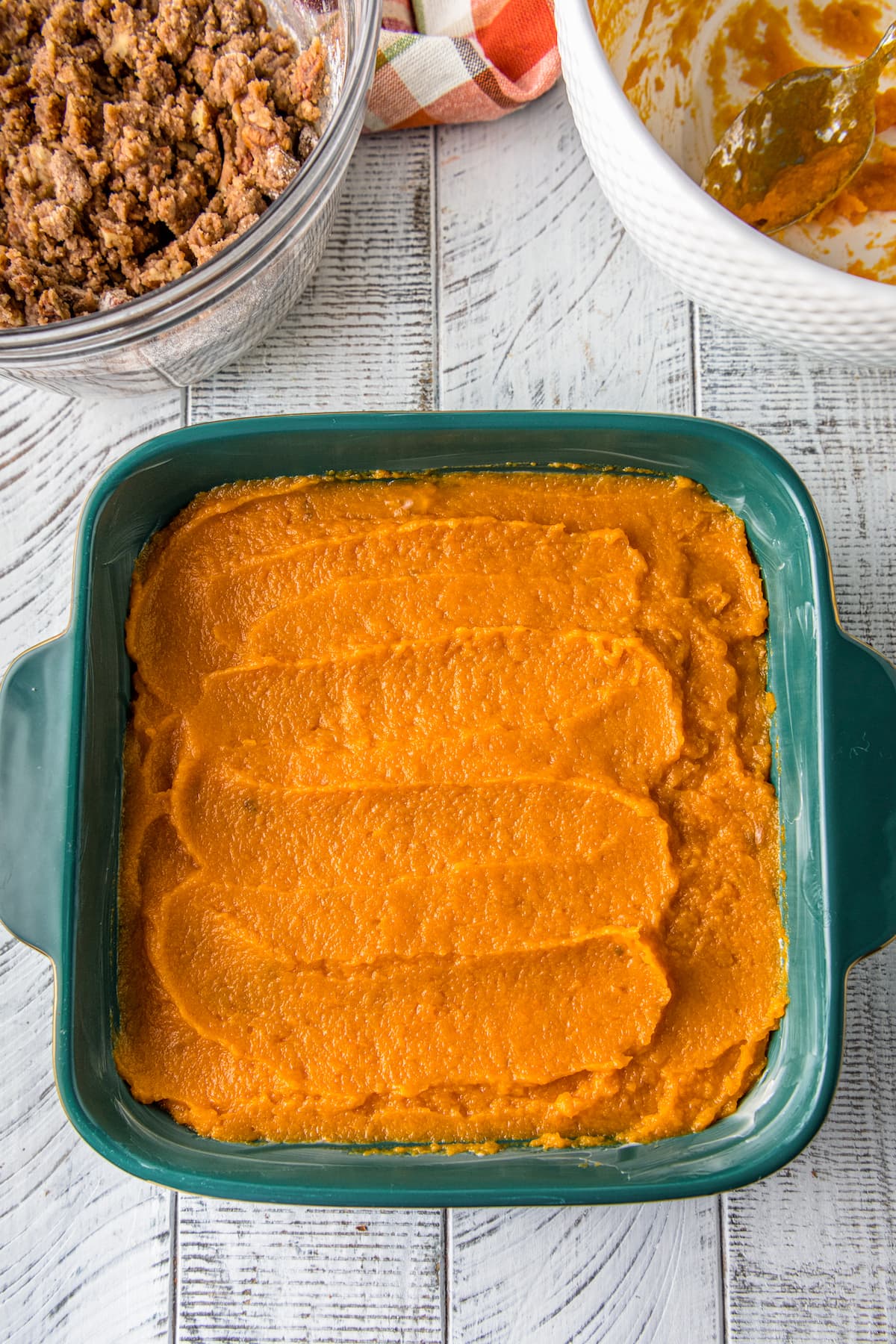 pureed sweet potatoes in a teal casserole dish
