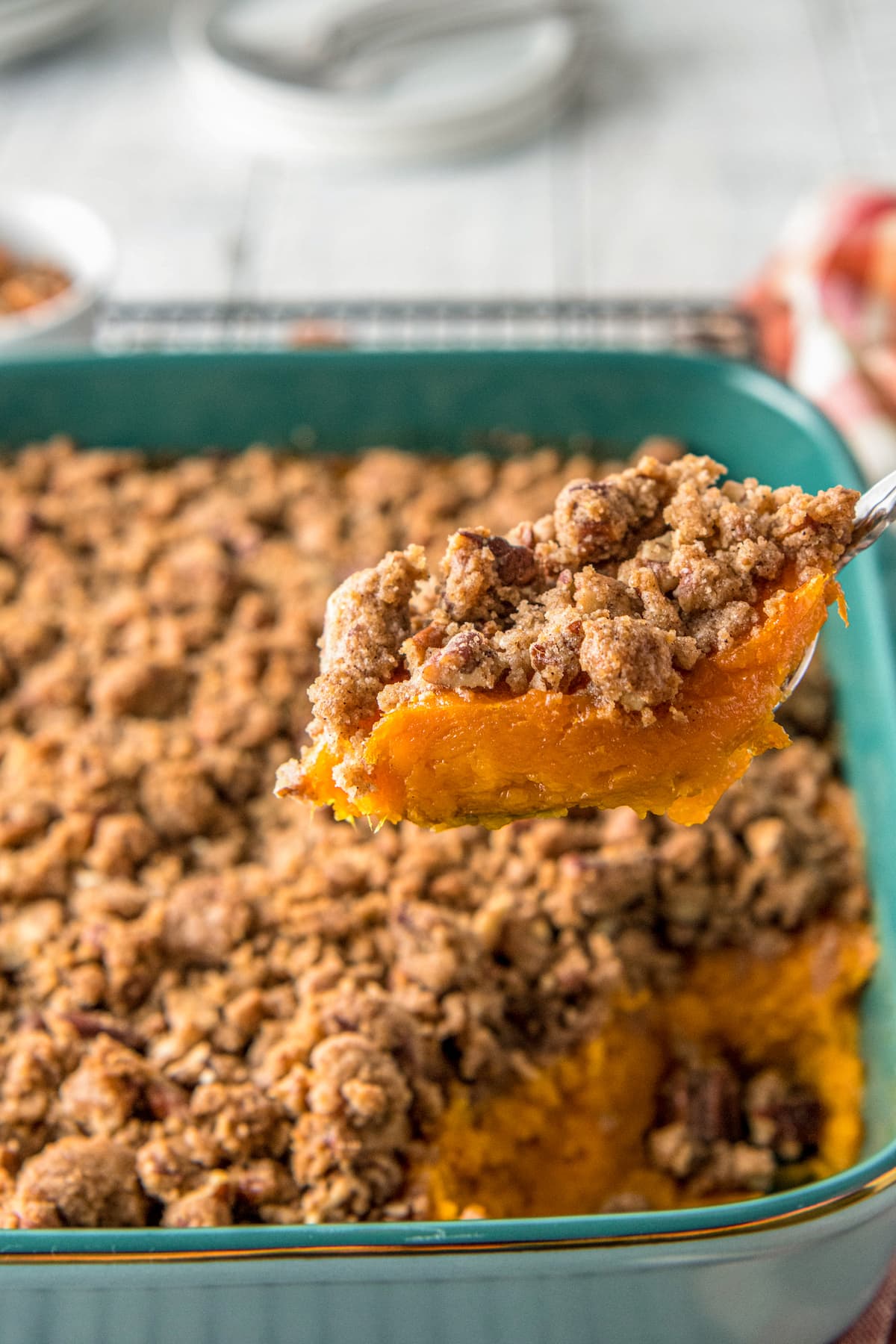 a slice of sweet potato casserole with crumbled topping