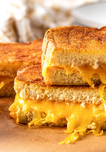 close up of a grilled cheese sandwich cut in half