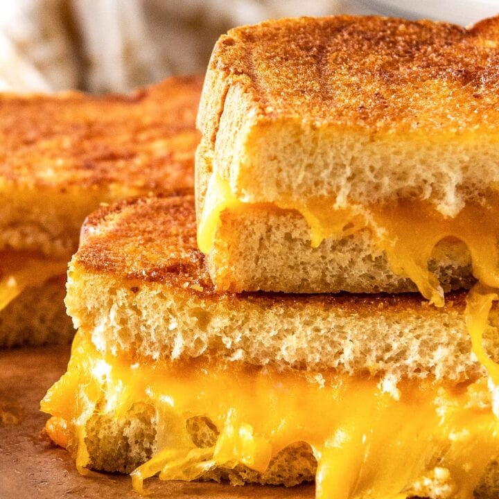 close up of a grilled cheese sandwich cut in half