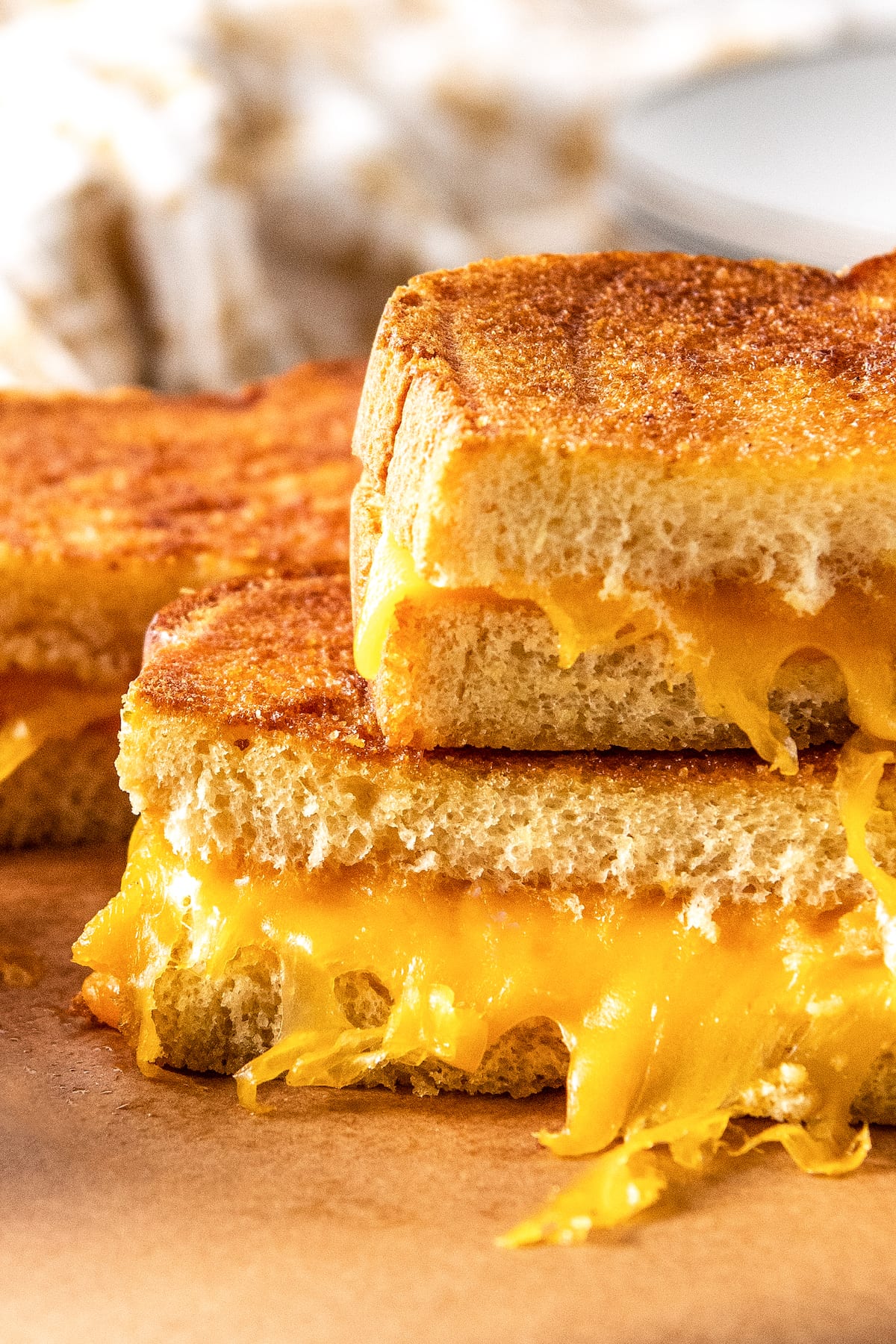 close up of a grilled cheese sandwich cut in half